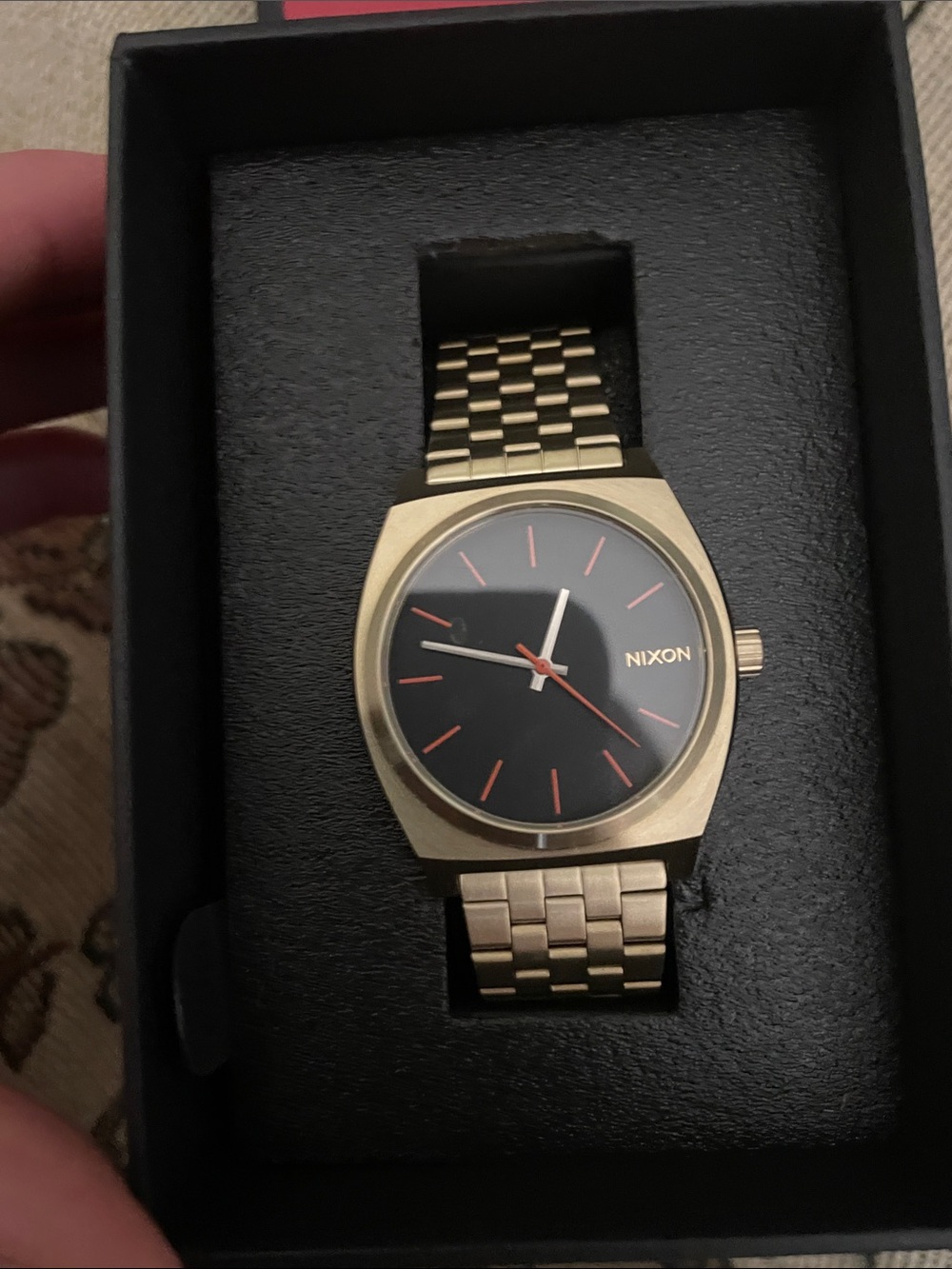 Nixon Gold Tone Bracelet Watch with Black Dial and Red Accents